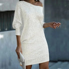 Black Olwen sequin mini dress with round neckline by Lumina Vancouver, shown on a model with a sleek, fitted silhouette.