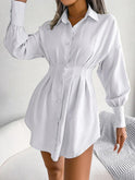 Dark green Nova Lumina tailored mini shirtdress, stylish and fitted, displayed on a hanger.