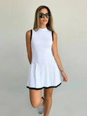 Black Nova sleeveless pleated mini dress by Lumina Wear, featuring a stylish mini length and elegant pleated design.