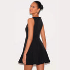 Gray Wilhelmine slim fit sleeveless A-line mini dress by Lumina Vancouver displayed on a hanger with a simple background.