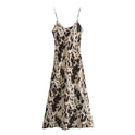 Beige Lumina Wear Aoife slip dress in silky satin with V-neck, mini length, shown on a model against a neutral background.