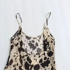 Beige silky satin Aoife slip dress by Lumina Vancouver featuring a V-neck, mini length, and elegant sleeveless design.