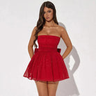 Red Kirsty strapless mini dress with A-line silhouette and tulle fabric, shown from the front on a model.