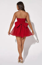 Red Kirsty strapless mini dress from Lumina Vancouver with an A-line tulle design, shown on a model.