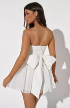 Red Kirsty strapless mini dress by Lumina Vancouver featuring an A-line silhouette and tulle fabric.