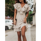 Pink Maren V-neck mini dress with tiered design by Lumina Vancouver, showcasing a stylish and flowy silhouette.