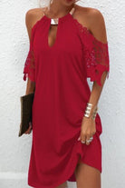 Black women's cold shoulder mini dress by Lumina Vancouver, featuring a stylish off-shoulder design and fitted silhouette.