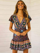 Blue floral print Gwyn wrap dress by Lumina Vancouver, a stylish mini dress with elegant floral details and a flattering fit.