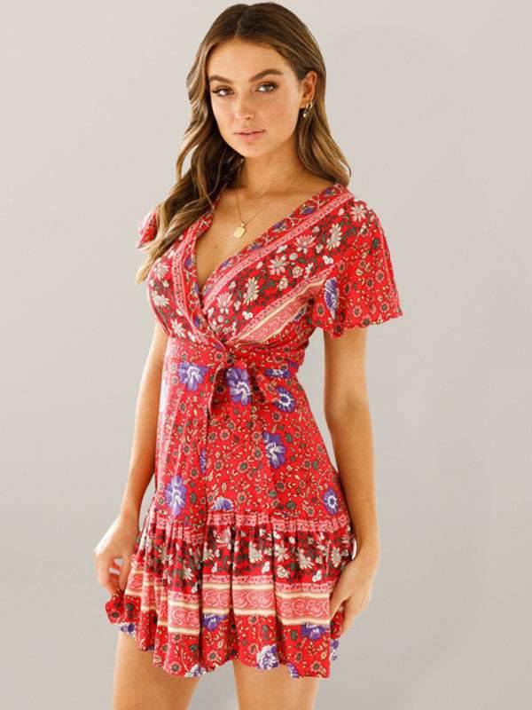 Blue floral print Gwyn wrap mini dress by Lumina Vancouver, featuring a stylish and feminine design.