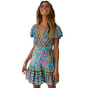 Red floral Nova wrap dress by Lumina Wear, short sleeve mini dress with a flattering fit and vibrant print.