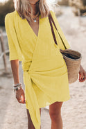 Yellow Nova Wrap Mini Dress by Lumina Wear, made of cotton and linen, shown in size S on a model.