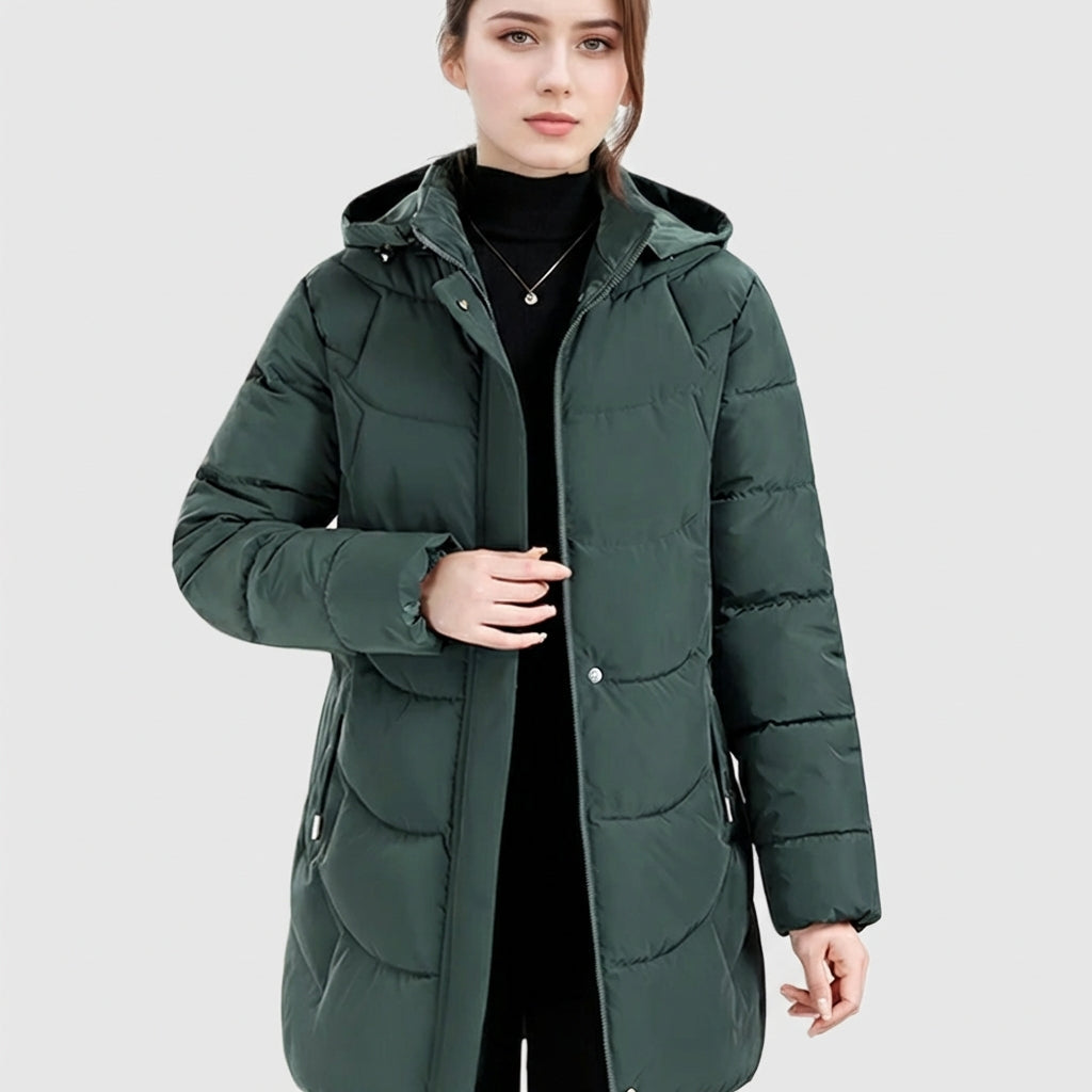Women's Lumina Wear Olivia cozy longline hooded puffer coat with quilted design in dark green, featuring a warm, stylish fit.