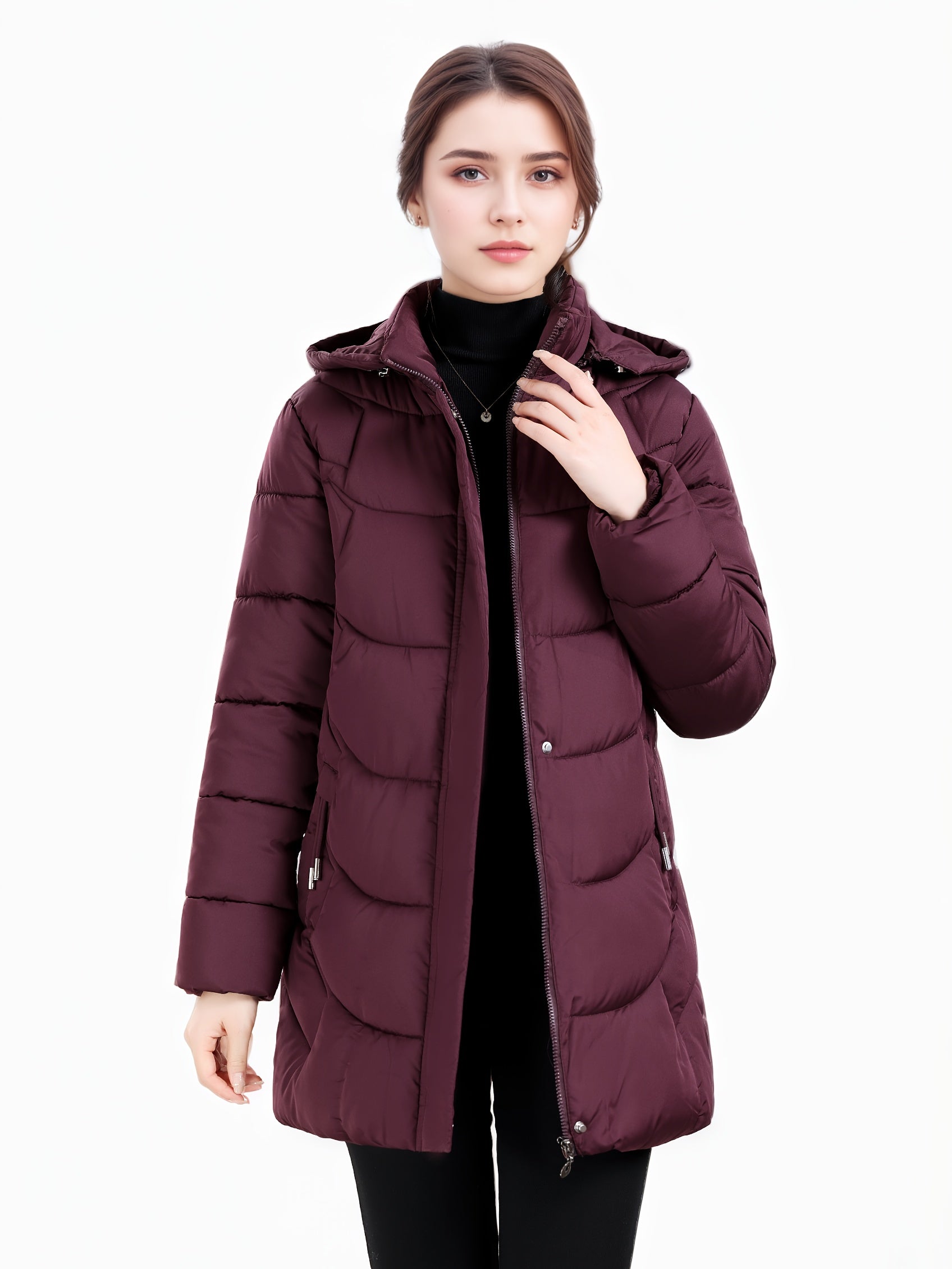 Dark green Olivia Lumina women's longline puffer coat with hood and quilted design, cozy and stylish winter outerwear.