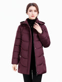 Dark green Olivia Lumina Wear longline hooded puffer coat with quilted design, cozy and stylish for women.