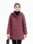 Olivia women's longline hooded puffer coat with quilted design in dark green by Lumina Wear, cozy and stylish for winter warmth.