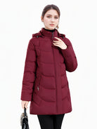 Dark green Olivia puffer coat by Lumina Wear, cozy longline hooded jacket with quilted design for women.