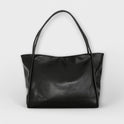 Black Olivia Lumina tote bag featuring a minimalist design and spacious interior, made by Lumina Wear.