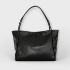 Black Olivia Lumina tote bag with a minimalist design and spacious interior, perfect for everyday use.
