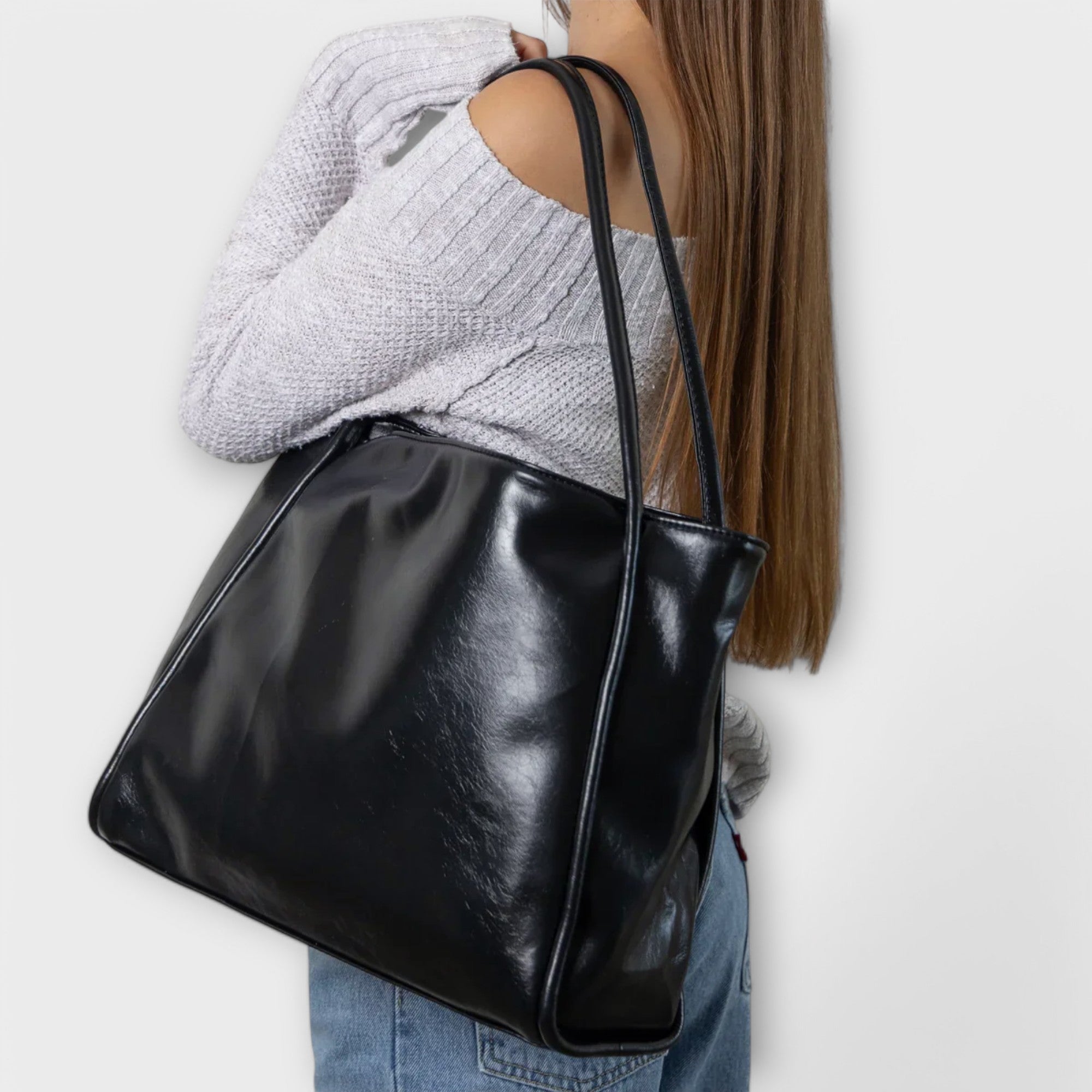 Black Olivia tote bag by Lumina Wear featuring a minimalist design and spacious interior, perfect for everyday use.