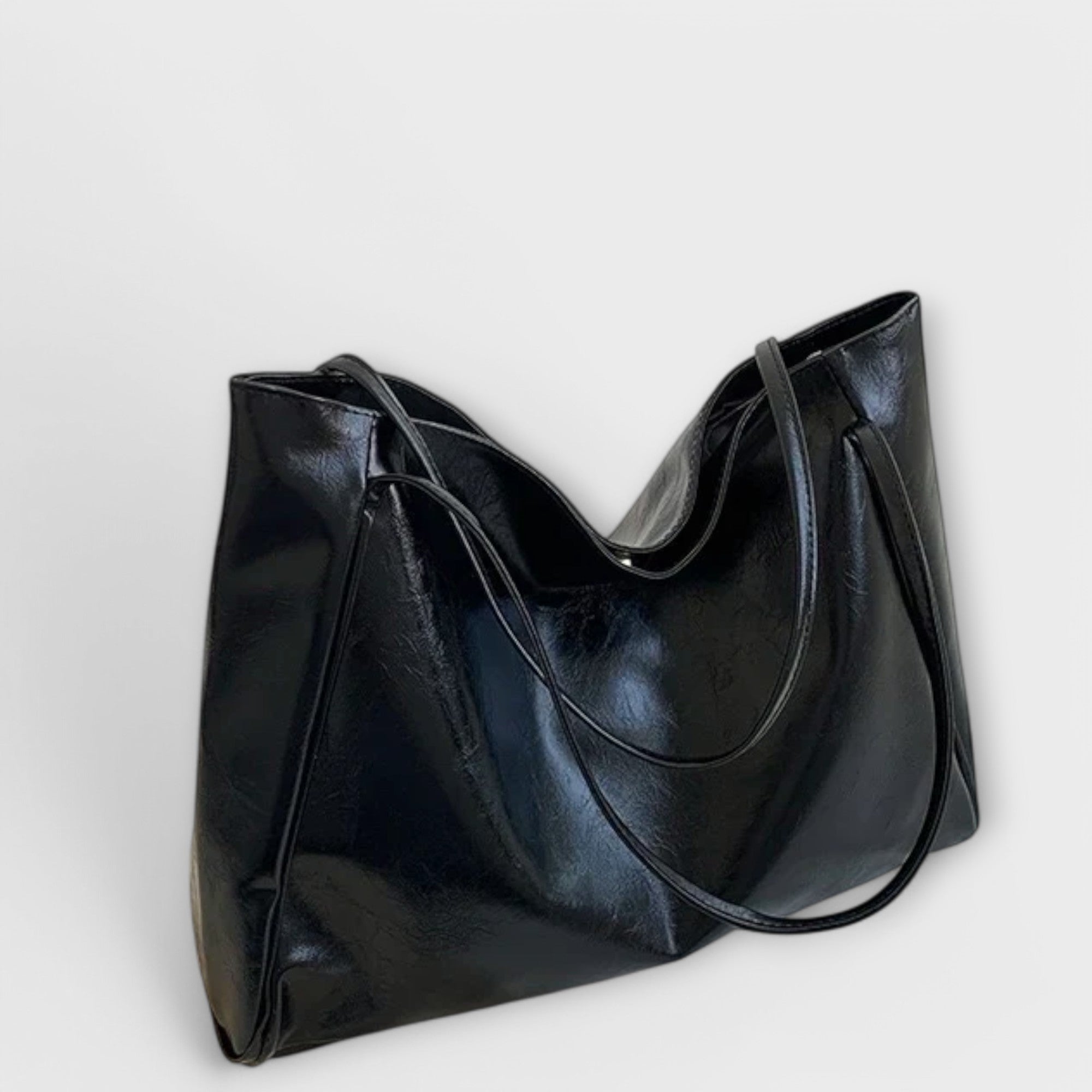 Black Olivia tote bag by Lumina Wear, minimalist design with spacious interior, perfect for everyday use.