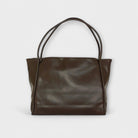 Black Olivia tote bag by Lumina Wear, minimalist design with spacious interior, casual and versatile tote for daily use.