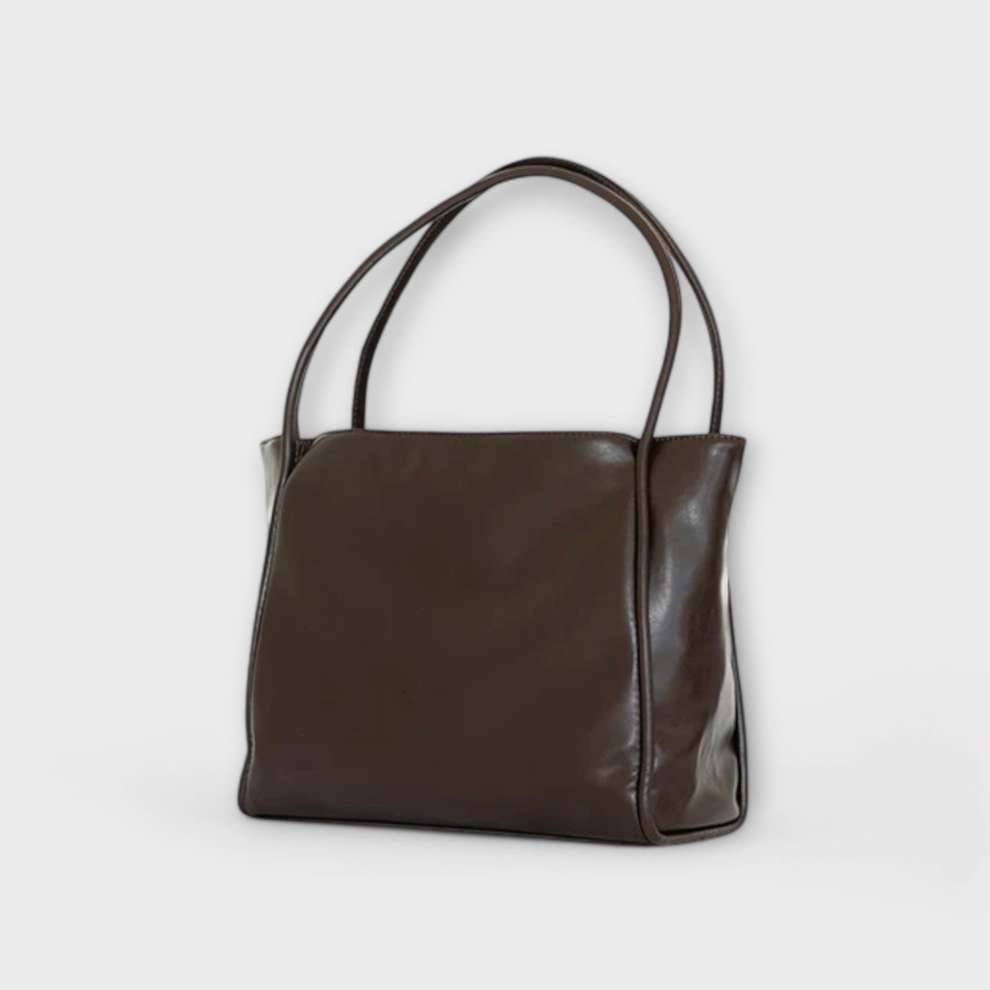 Black Olivia tote bag by Lumina Wear featuring a minimalist design and spacious interior, perfect for everyday use.