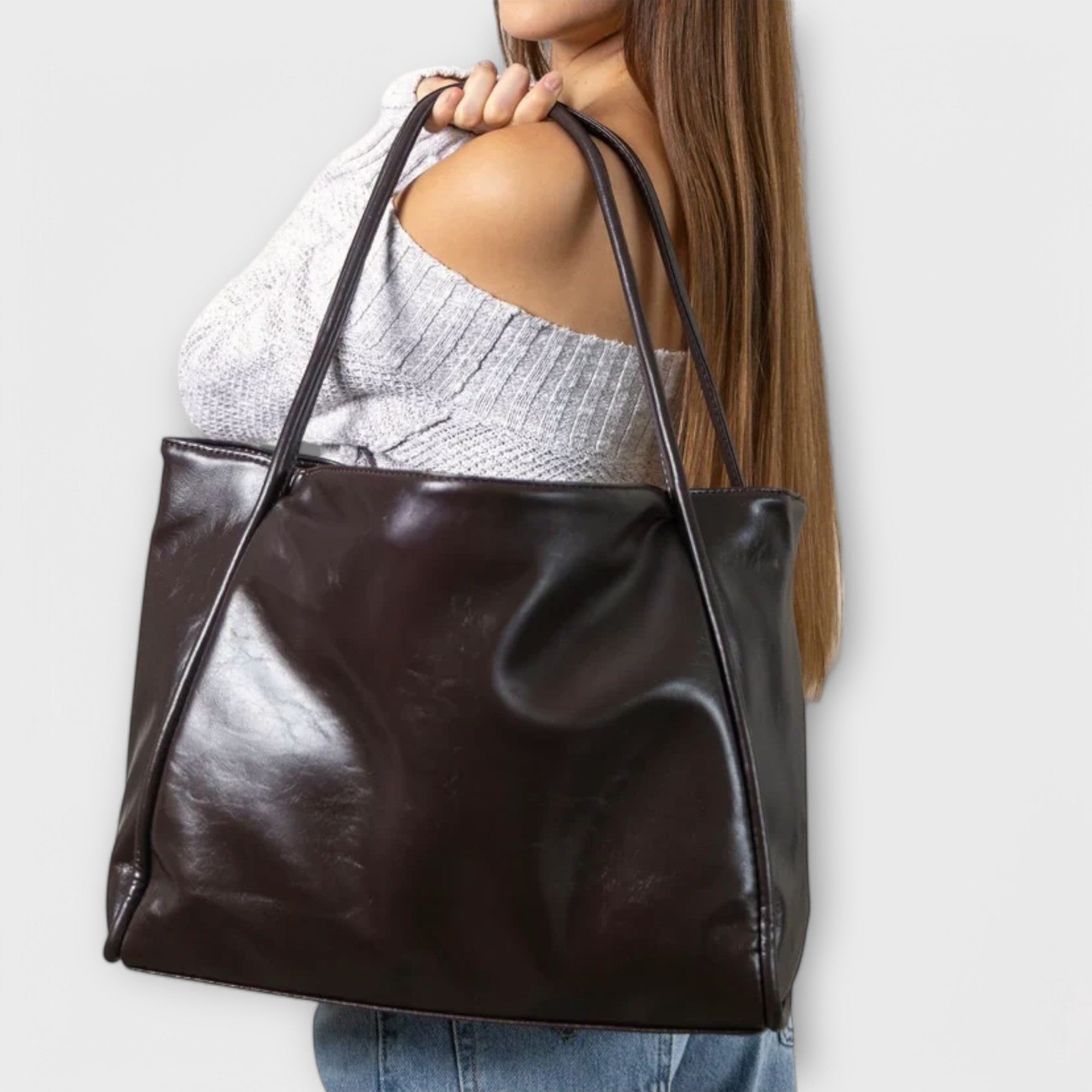 Black Olivia tote bag by Lumina Wear, minimalist design with spacious interior, perfect for everyday use.