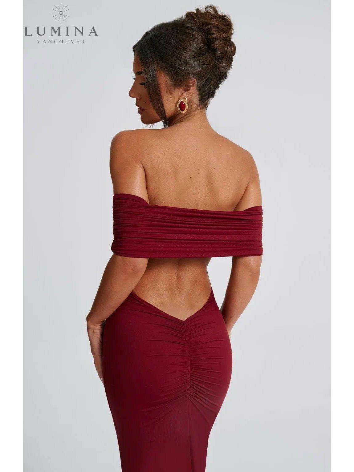 Black Olympia elegant backless maxi dress by Lumina Vancouver, perfect for wedding guests, shown on a model.