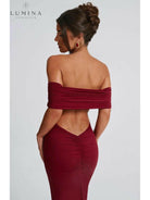 Black Olympia elegant backless maxi dress by Lumina Vancouver, perfect for wedding guests, shown on a model.