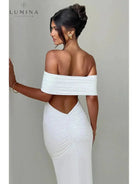 Black Olympia backless maxi dress by Lumina Vancouver, perfect for wedding guests, featuring an elegant, flowing design.