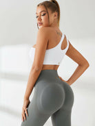 Black one-shoulder sports ankle bra by Lumina Vancouver, designed for support and style during active workouts.