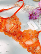 Orange floral embroidery lingerie set, 2-piece by Lumina Vancouver with delicate lace and vibrant floral details.