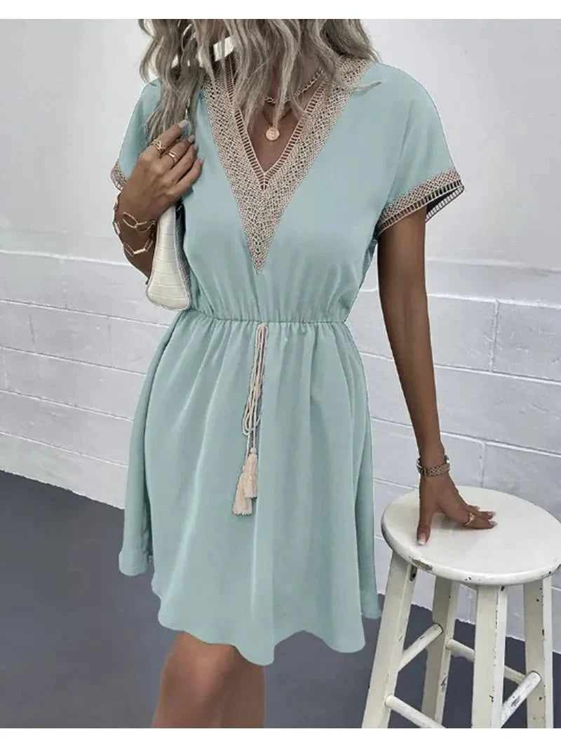 White Paula™ bohemian dress by Lumina Vancouver featuring flowing fabric and relaxed style, perfect for casual or summer wear.