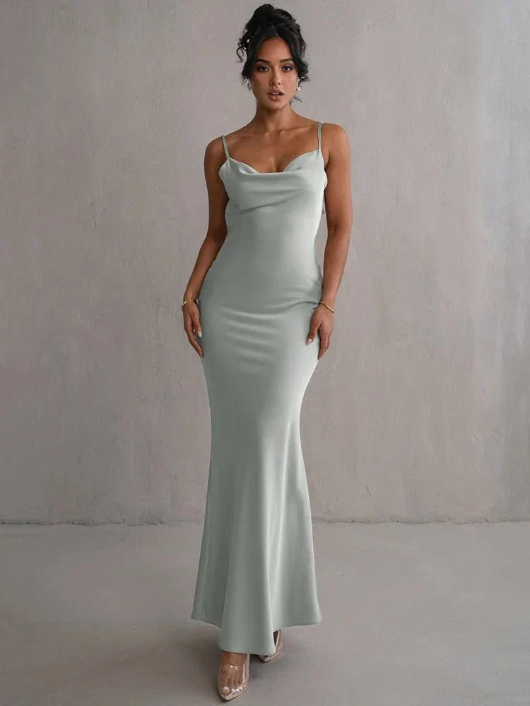 Light green Pauline backless maxi dress by Lumina Vancouver, elegant and sultry with flowing fabric and stylish design.