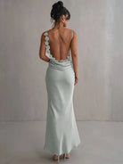 Light green Pauline elegant backless maxi dress by Lumina Vancouver, featuring a flowing silhouette and sultry design for formal occasions.