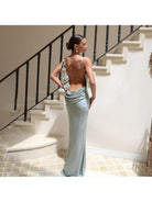Light green Pauline elegant backless maxi dress by Lumina Vancouver, showcasing a sleek, sultry design and flowing fabric.