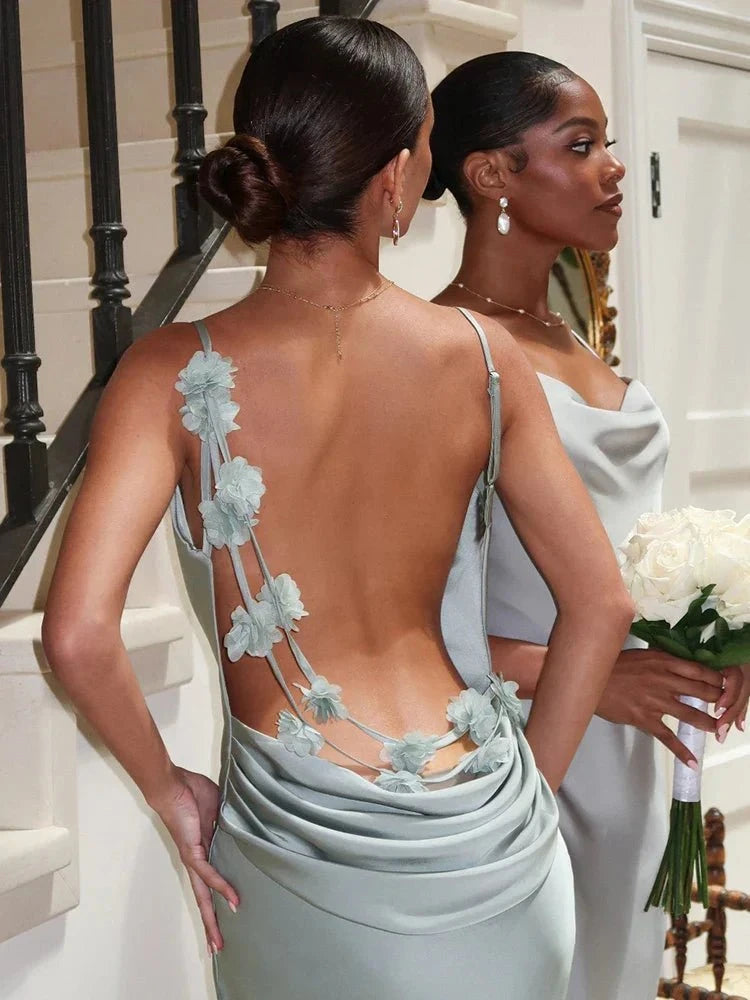 Light green Pauline backless maxi dress by Lumina Vancouver, elegant and sultry, flowing fabric with a fitted silhouette.