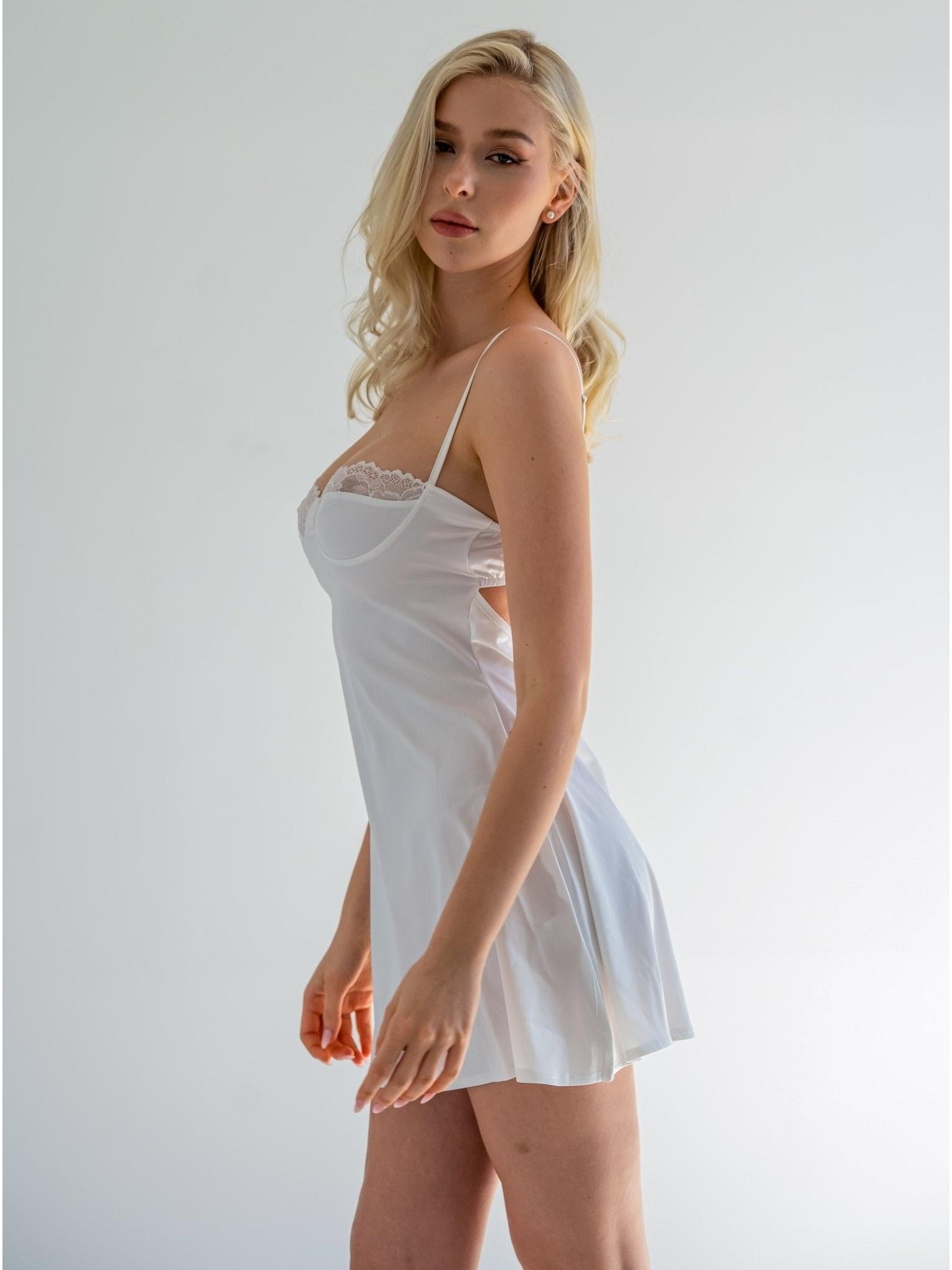 White luxurious satin nightdress shaped like a pear, by Lumina Vancouver, with delicate details and smooth fabric.