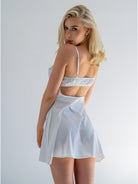 White satin nightdress by Lumina Vancouver featuring a pear-shaped design and elegant, luxurious fabric.
