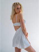 White satin nightdress by Lumina Vancouver featuring a pear-shaped design, luxurious fabric, and elegant nightwear style.