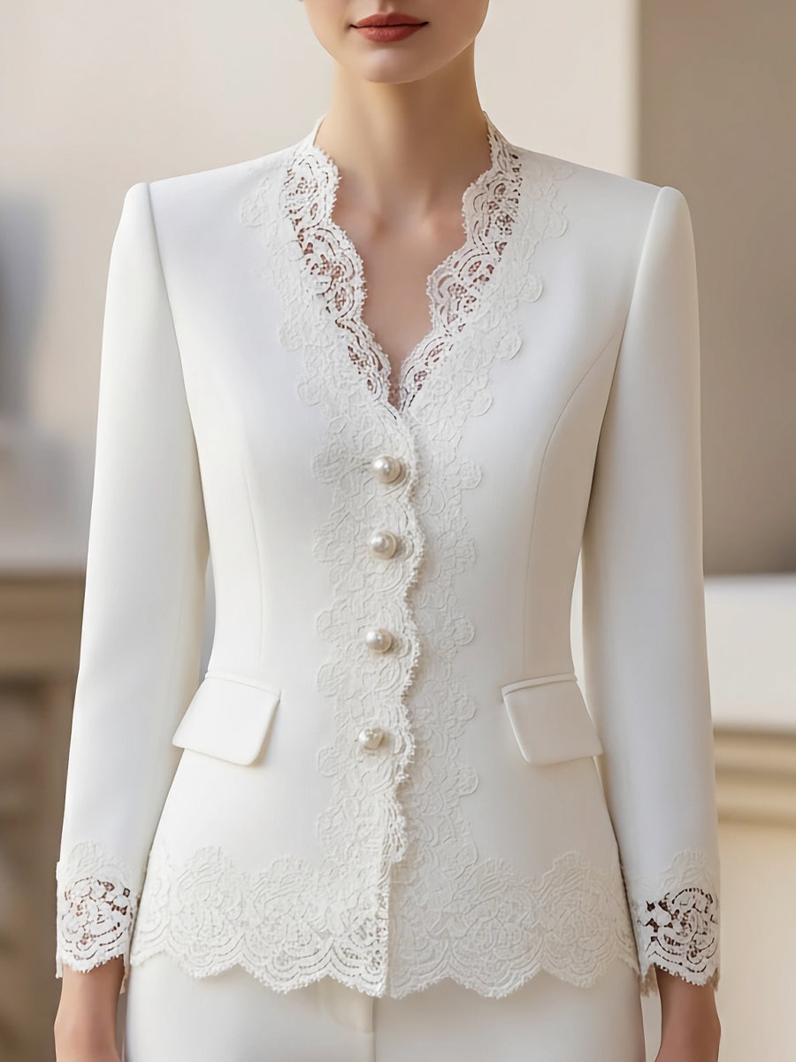 White pearl blazer jacket from Lumina Wear, size XS, shown on a model, stylish and tailored for a sophisticated look.