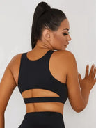 Black Peatacle Sports Bra by Lumina Vancouver, close-up showing breathable fabric and supportive design for active wear.