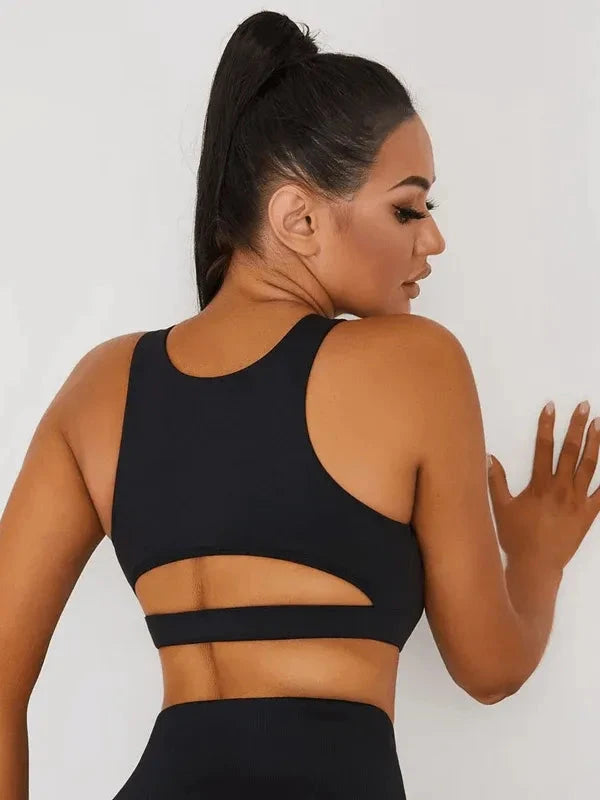 Black Peatacle Sports Bra by Lumina Vancouver, close-up showing breathable fabric and supportive design for active wear.