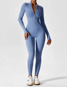 Black Penelope Lumina Wear fitted two-piece dress with zip detail, showcasing sleek style and modern design.
