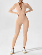 Black Penelope Lumina Wear fitted two-piece dress with zip detail, showcasing a sleek and stylish design.