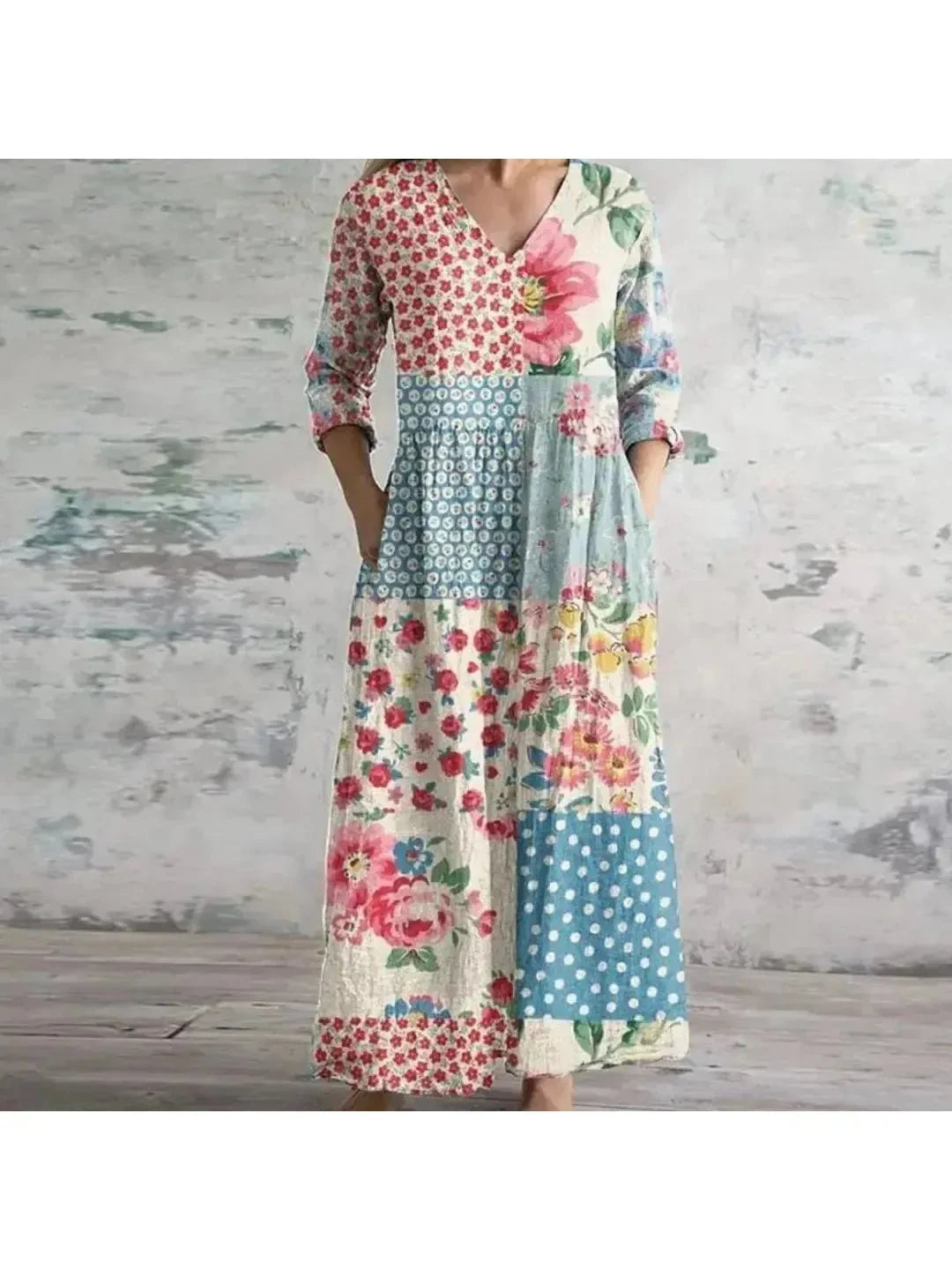Polly retro maxi dress by Lumina Vancouver featuring vibrant multi-colored floral patterns in red and blue.