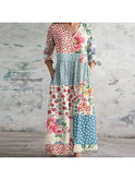 Polly retro maxi dress by Lumina Wear featuring vibrant red and blue multi-colored floral patterns, flowing fabric, and a relaxed fit.