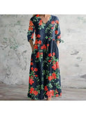 Polly retro maxi dress by Lumina Wear featuring multi-colored floral patterns in red and blue, flowing and stylish.