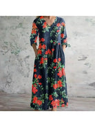 Polly retro maxi dress by Lumina Vancouver featuring vibrant multi-colored floral patterns in red and blue.