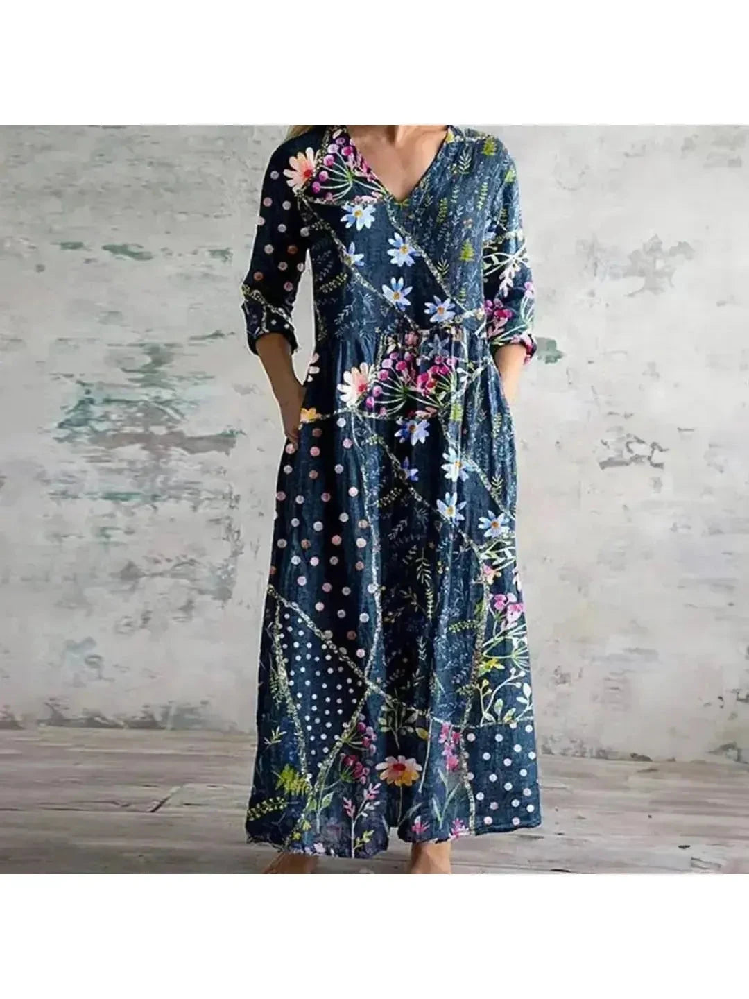 Polly retro maxi dress by Lumina Vancouver with multi-colored floral patterns in red and blue, flowing and stylish for warm weather.